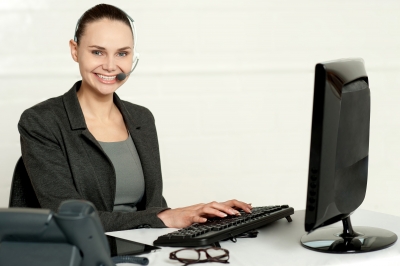 Lady providing Customer Services at desk